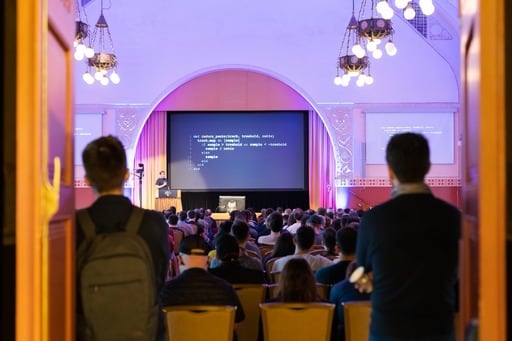 Thijs shows Ruby code, view from the back of the hall
