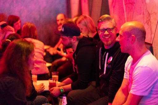 Matias Korhonen and Andy Croll having a discussion at the party