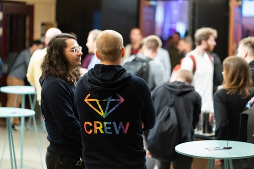 Two crew members in the foyer